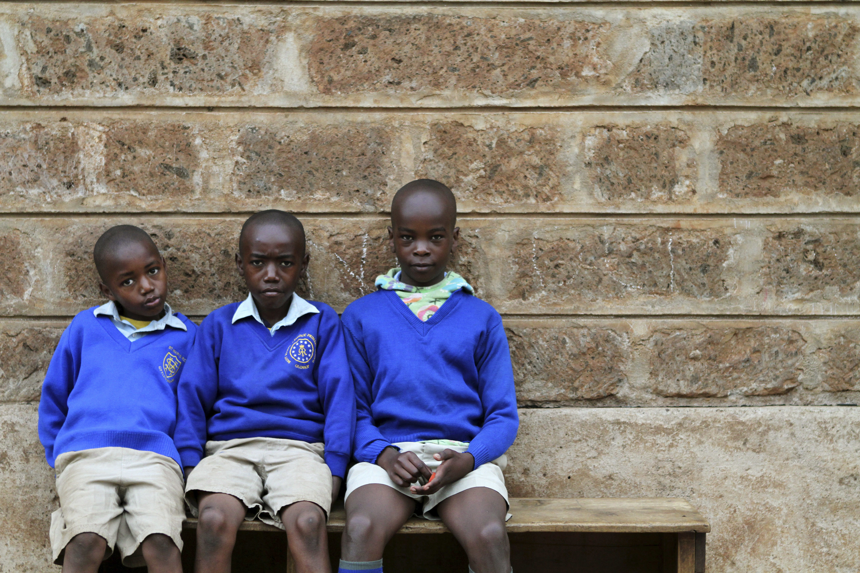 Children sit outside their classroom as a nationwide strike by Kenyan