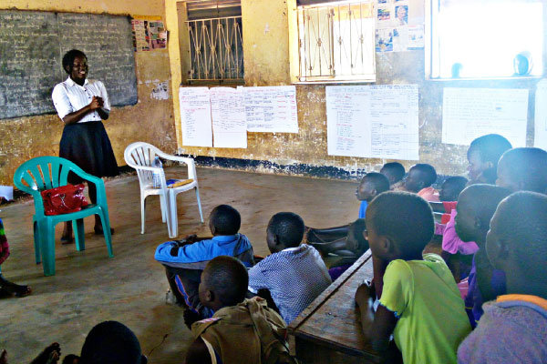 Frances Aanyu, member of Dash for Girls, addresses school children