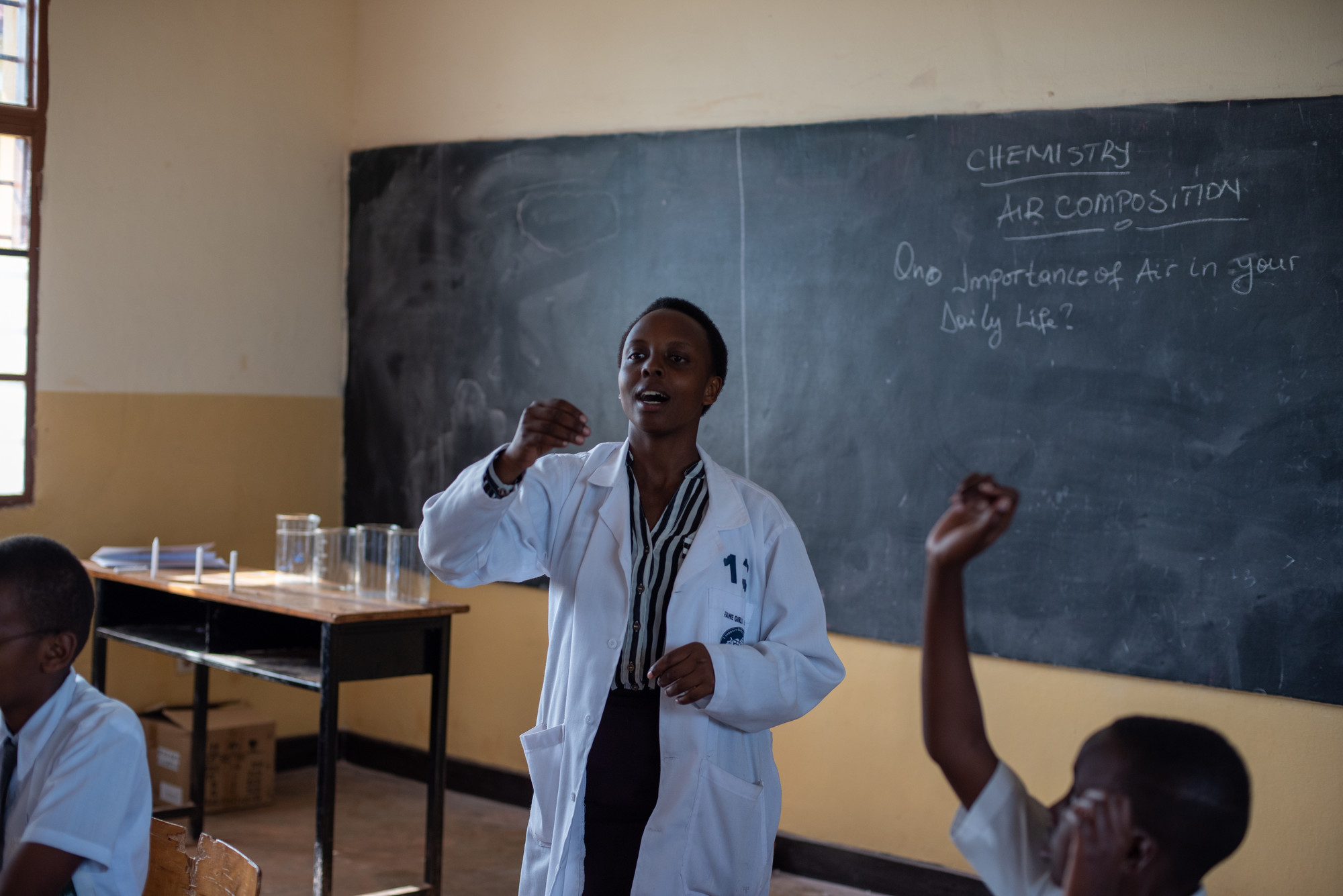 A teacher-in-training practices teaching at a secondary school.