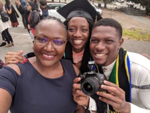 Mastercard Foundation Scholars Sarah Lebu (Kenyan), Kwinoja Kapiteni (Tanzanian), and Chidi Uwaeme (Nigerian) during a graduation ceremony at the University of California Berkeley in 2019