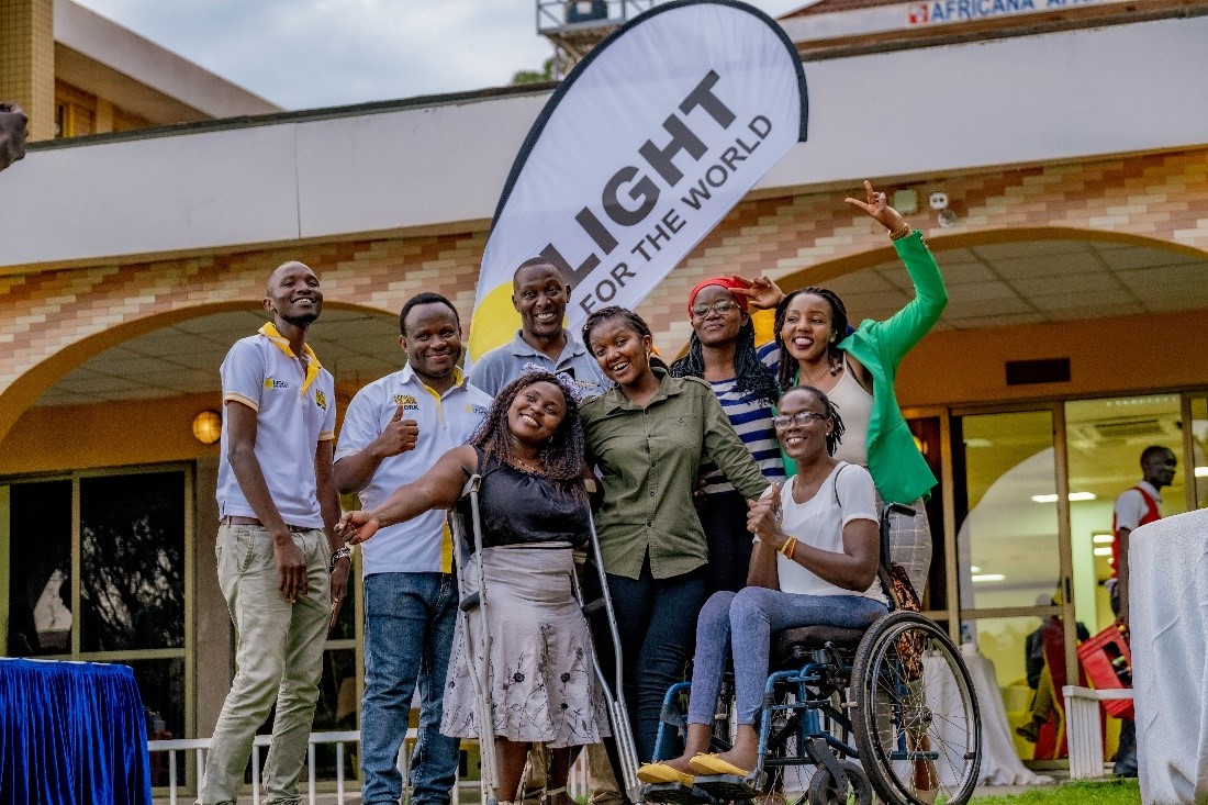 Cover Image: Light for the World Team, Disability Inclusion Facilitators, and member of partner organizations celebrate a successful career fair for youth with disabilities.
